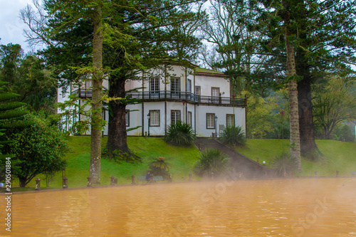 Hot water and natural sulfur pool in a garden in Furnas area, São Miguel Island, Azores