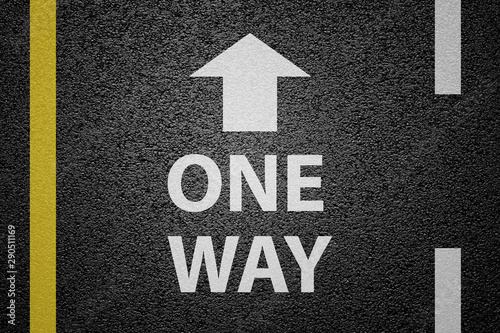 One way sign on asphalt ground