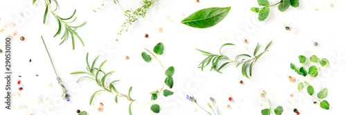 Culinary herbs and spices, shot from above on a white background, cooking pattern, a flat lay panorama