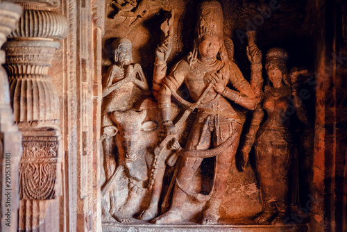 Sculptures of Shiva lord inside of 6th century Hindu temple in India. Architecture with carved walls in Badami