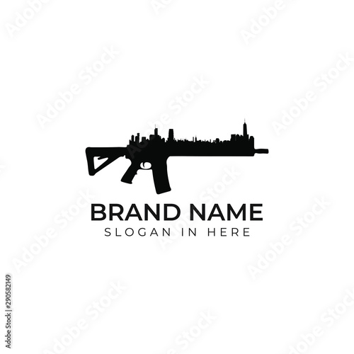 Gun with city shaped inside logo design vector