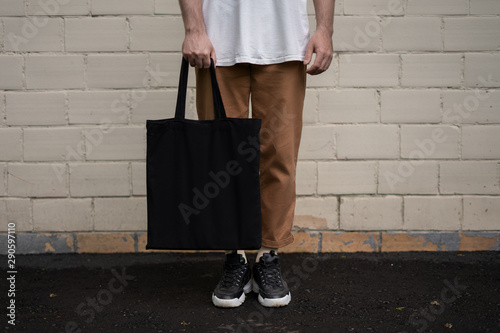 Man holding cotton Black Tote bag