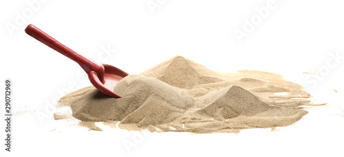 Beach toy for kids, plastic tool in sand pile isolated on white background