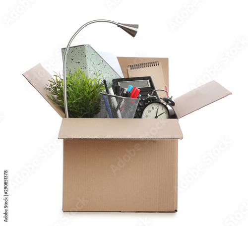 Cardboard box full of office stuff on white background