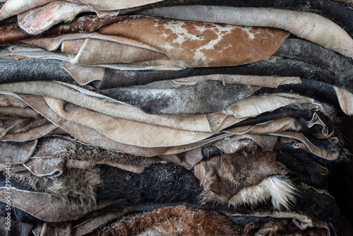 Pieces of raw leather stacked in tannery