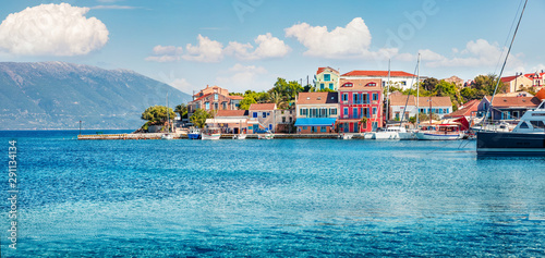 Panoramic spring view of Fiskardo port. Colorful morning seascape of Ionian Sea. Bright outdoor scene of Kefalonia island, Greece, Europe. Traveling concept background.
