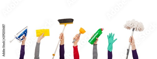hands up and holding brush and dustpan