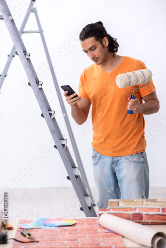 Young man contractor doing renovation at home