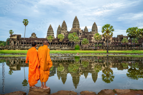 Asian monk stand and look to Angkor wat in siem reap