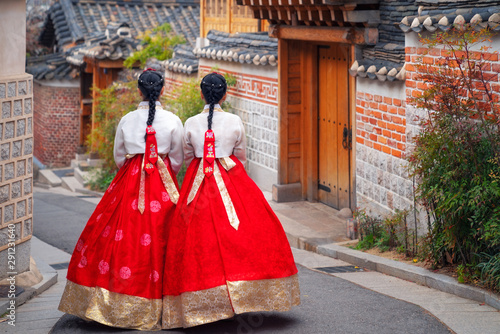 Korean lady in Hanbok or Korea dress and walk in an ancient town in seoul