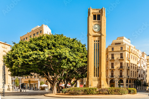 Al-Abed Nejmeh Square clock tower with tree and buildings around, Beirut, Lebanon