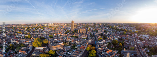 Wide panoramic aerial view of the medieval Dutch city centre of Utrecht with cathedral towering over the city at early morning sunrise. Cityscape in The Netherlands