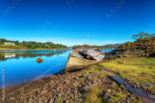 An old fishing boat on the shore of Gair Loch at Badachro