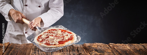 Chef making a traditional Italian pizza