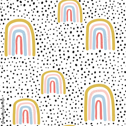 Childish seamless pattern with hand drawn rainbow and dots. Trendy kids vector background.
