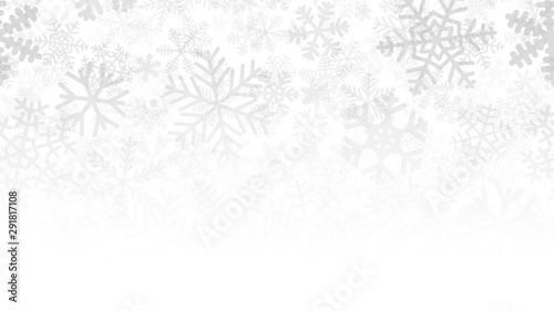 Christmas background of many layers of snowflakes of different shapes, sizes and transparency. Gradient from gray to white