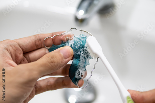 cleaning retainer with toothbrush and toothpaste