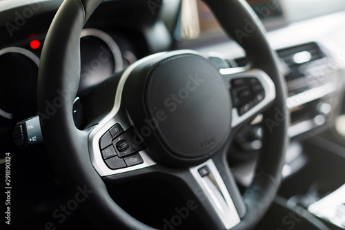 Modern luxury car Interior. Automotive detail in a new car