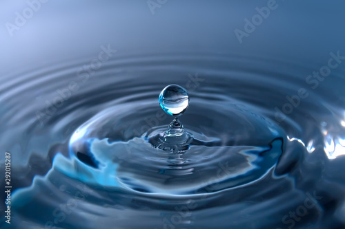 Water splash or drop. Water splash close-up. Blue water drop. Falling water