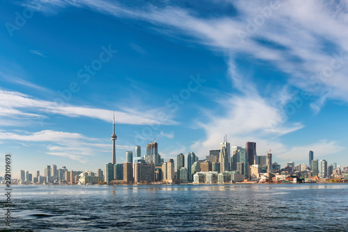 Toronto city skyline on sunny summer day, Toronto, Ontario, Canada. Blue sky copy space.