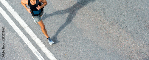 Close up of runner feet. Fitness background, close up of runner feet on the road.