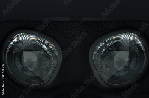 Closeup of fresnel lenses on a black virtual reality headset.