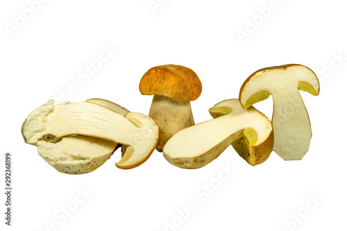 Whole and sliced halved Boletus mushrooms on white