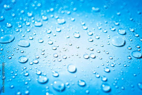 Water droplets on light blue background