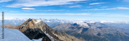 XXL wide angle Swiss alps panorama view seen from the summit of Weissmies mountain (4017m), Switzerland. Lagginhorn and Fletschhorn in the foreground, Aletschhorn and Finsteraarhorn in the background.