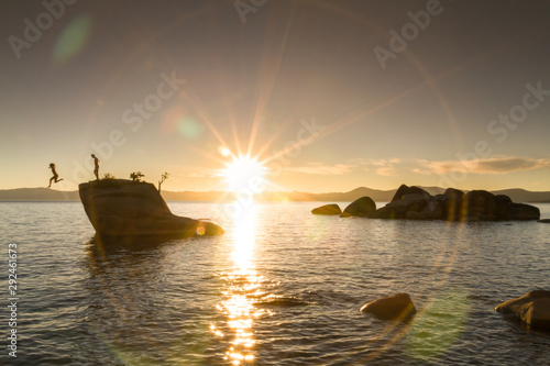 People jumping off Bonsai Rock in Lake Tahoe, California