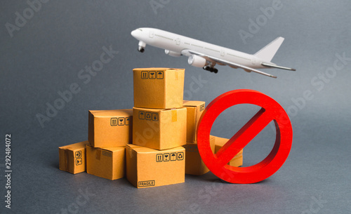 Cargo plane, many boxes and red prohibition symbol NO. Embargo trade wars. Restriction on importation, ban transit export dual-use goods to countries under sanctions. transport companies.