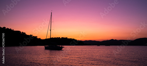 Sailboat at colorful evening