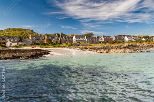 Houses Lining the Harbor of Iona Isle Scotland Blue Sky and Turquoise Sea 