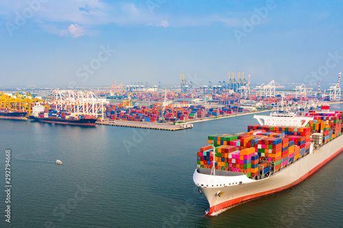 top aerial view of the large volume of TEU containers on ship sailing to the sea carriage the shipment from loading port to destination, heading to the destination of success light