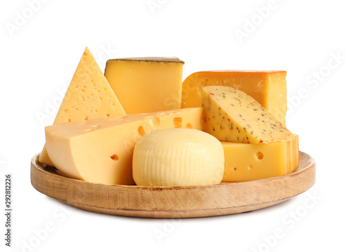 Wooden plate with different kinds of cheese on white background