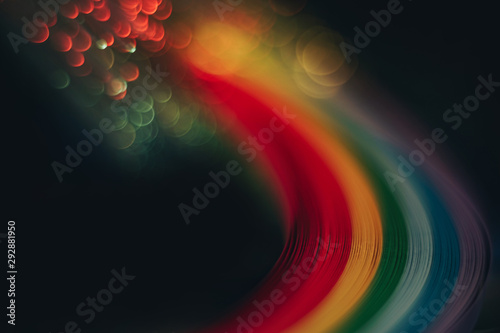 Beautiful abstract rainbow bridge and multi colored space background in the darkness.