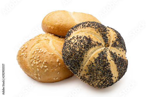 Plain, poppy seed amd sesame seed kaiser rolls isolated on white.