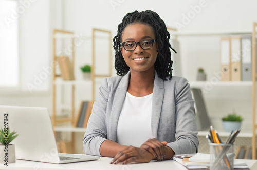 Afro Business Lady Smiling At Camera Sitting At Workplace