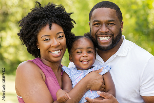 Happy African American family laughing and smiling.