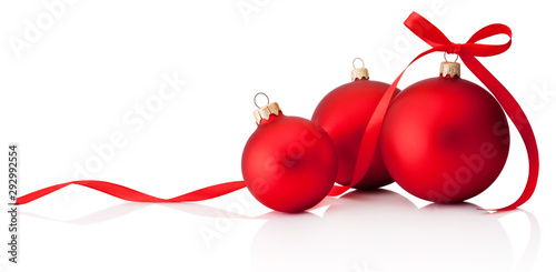 Three red Christmas decoration baubles with ribbon bow isolated on white background