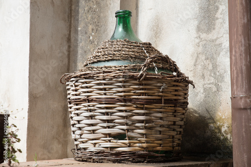 Empty carboy in rustic house