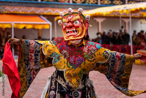 Monk performing a ritual dance in Takthok monastery, Ladakh