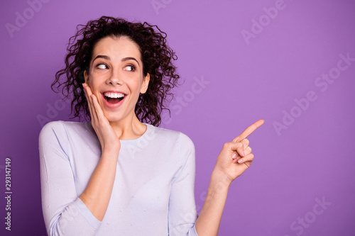 Photo of charming wavy lady holding arm on cheeks indicating finger empty space on black friday sale banner wear pullover isolated purple color background
