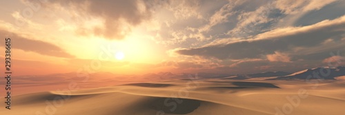 Sand desert at sunset under the sky with clouds.