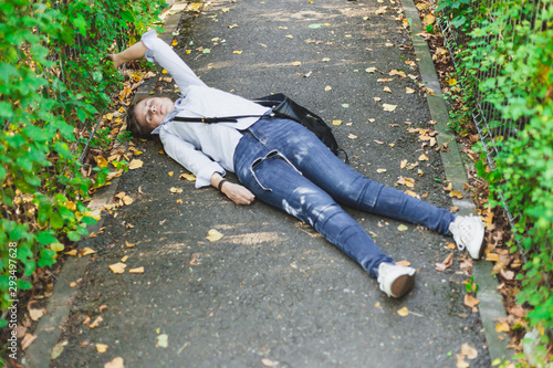 Young woman fainted on the street in the middle of the day