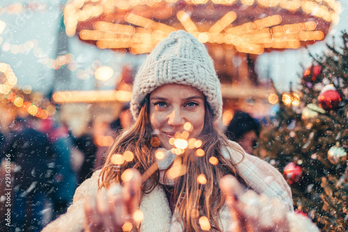 Girl walking on Christmas Market on Red Square in Moscow