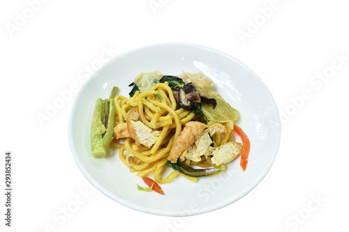 stir fried yellow noodles with cabbage and tofu vegetarian food on dish