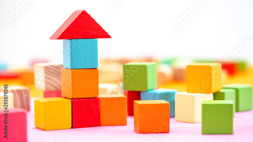 Colorful Wooden building blocks isolated on white background.