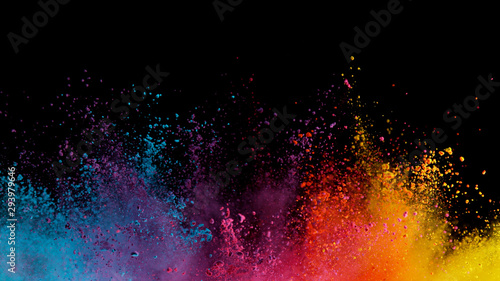 Explosion of colored powder on black background