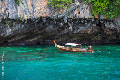 Long tail boat floating on the blue sea in Thailand